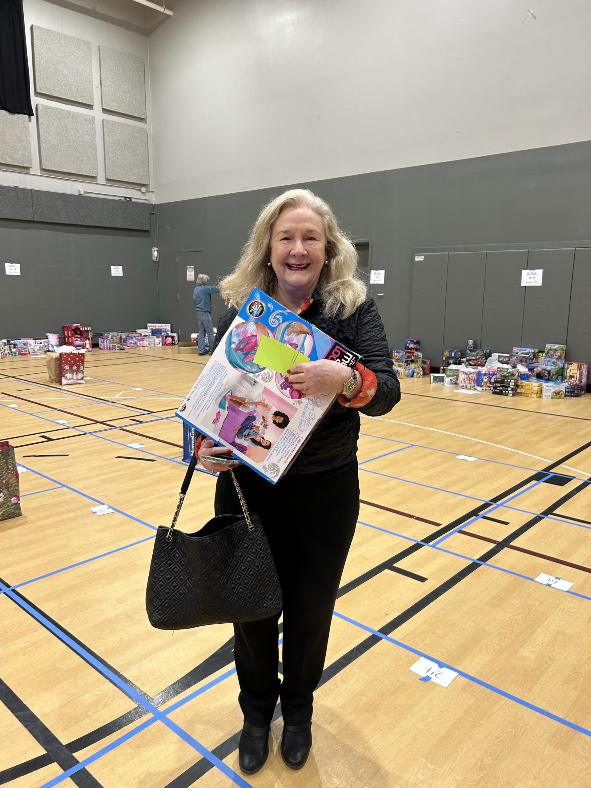 Woman getting gifts to wrap for families